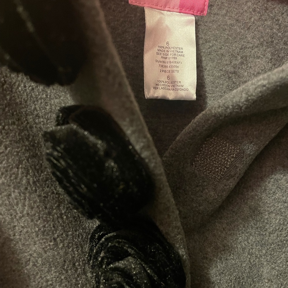 Girls grey and black pea coat, grey with black cuffs and black rose buttons.